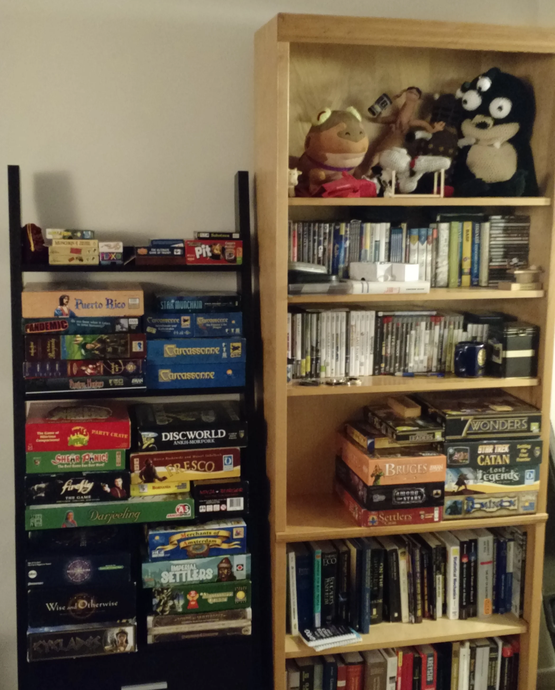 Our bookshelves just after she moved in with me (for the Fall) in Bloomington. Note in particular Star Trek Catan and the USS Enterprise she crocheted for me.
